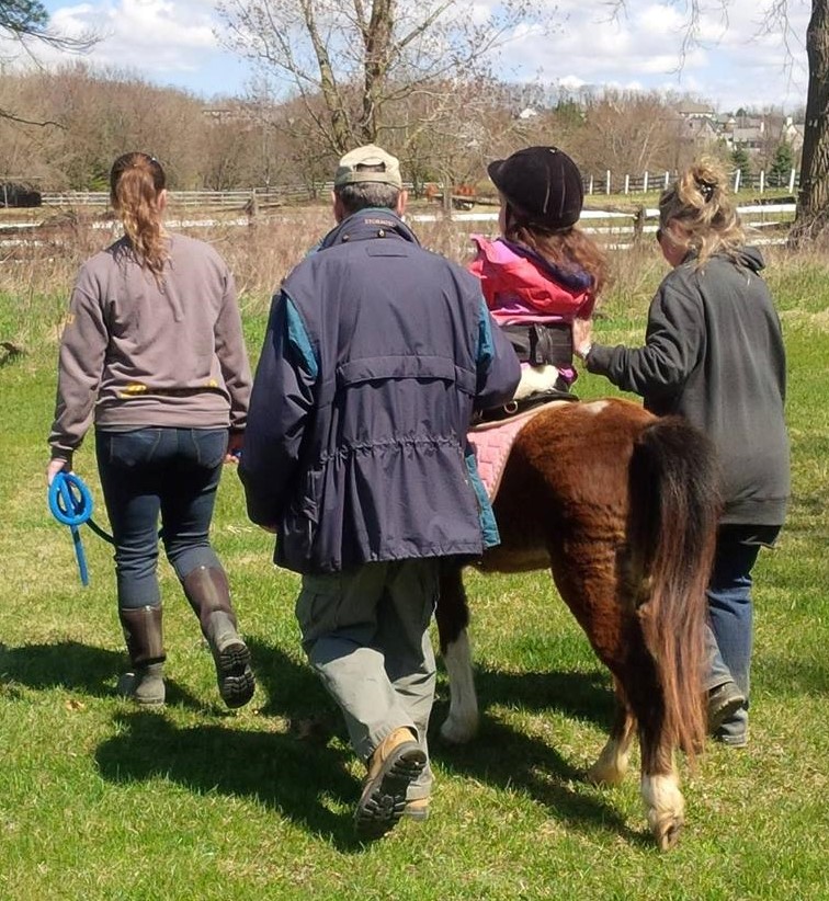 volunteers with rider